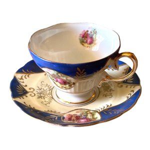 Teacup and Saucer Courting Couple on Blue Footed Cup Vintage